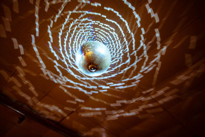 Low angle view of illuminated pendant light