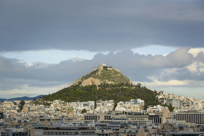 Buildings in city against sky