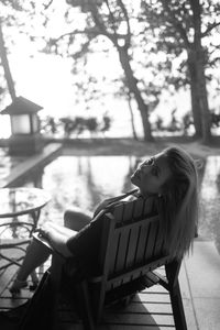 Portrait of young woman sitting on chair