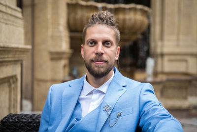 Portrait of young man standing outdoors