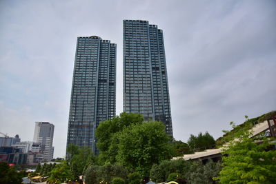 Low angle view of modern buildings against sky