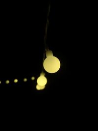 Low angle view of illuminated light bulb