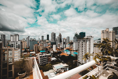 High angle view of buildings in city against sky