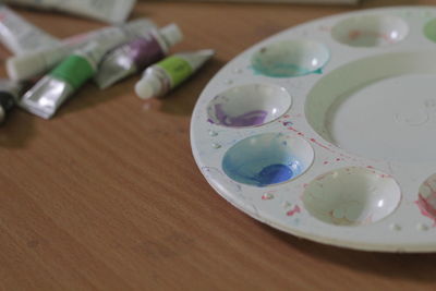 Close-up of water color palette on table