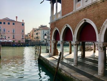 Canal amidst buildings in city