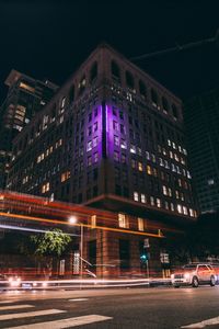 Light trails on road in city at night