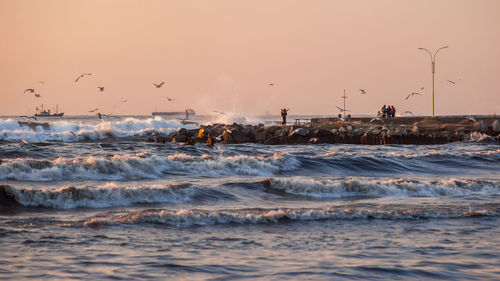 Scenic view of sea against clear sky during sunset