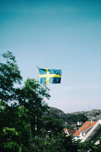 Low angle view of flag against sky