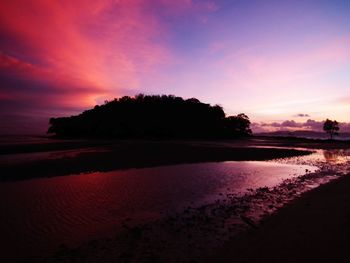 Scenic view of silhouette trees against sky during sunset