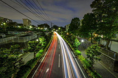 High angle view of light trails on road in city