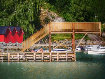 Bridge over lake against trees