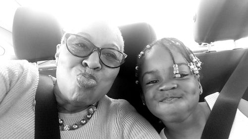 Portrait of friends sitting in car