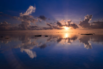 Scenic view of sea against sky at sunset