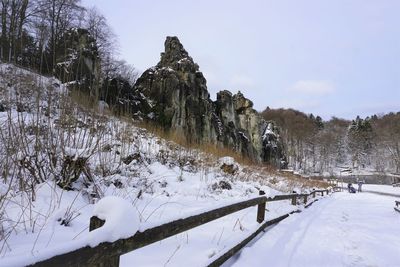 Panoramic view of snow covered mountain against clear sky