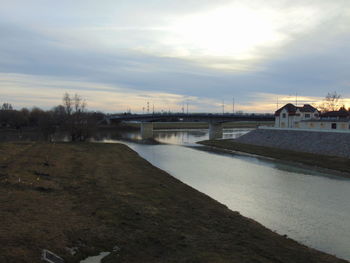 View of river against cloudy sky