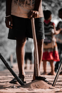 Indian boy ready to play cricket with his stick