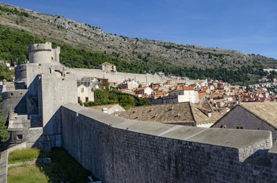 Houses against sky in town