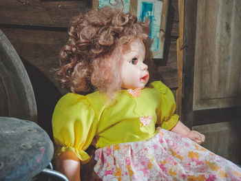 Close-up of doll against wall at home