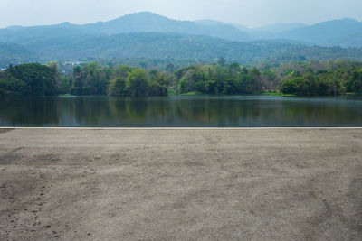 Scenic view of lake by mountains