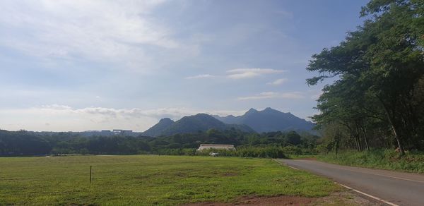 Scenic view of landscape and mountains against sky