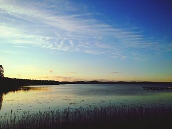 Scenic view of lake at sunset