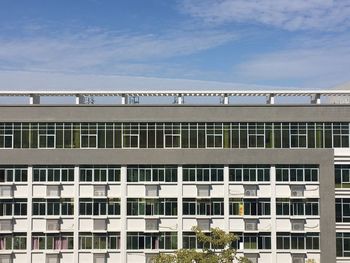 Low angle view of building against cloudy sky