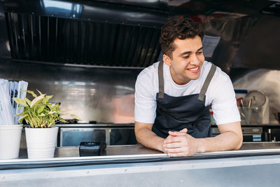 Full length of man working in restaurant