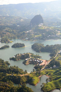 High angle view of townscape by sea against sky