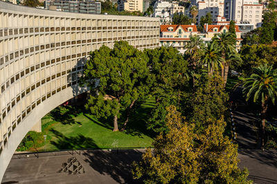 High angle view of trees by plants in city