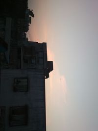 Low angle view of building against sky during sunset