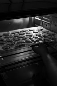 Close-up of person preparing food in kitchen