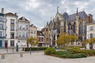 Buildings in city against sky