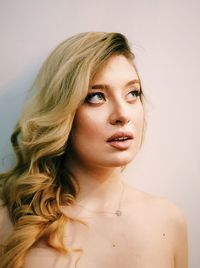 Portrait of a beautiful young woman over white background