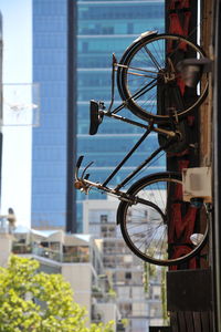 Close-up of bicycle parked against building
