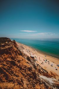 Scenic view of beach against blue sky