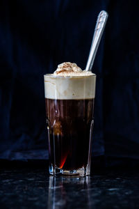 Glass of coffee on table