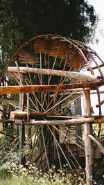 Old rusty wheel on field