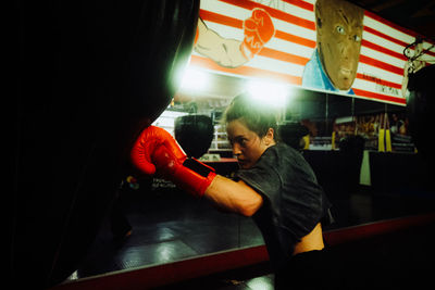 Rear view of man standing in gym