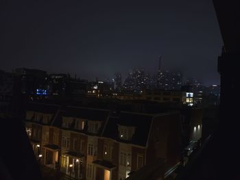 High angle view of illuminated buildings in city at night