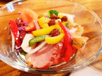 High angle view of fruit salad in glass bowl on table