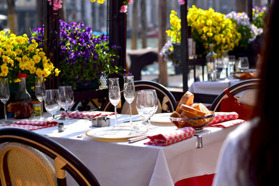 Place settings on elegant dining table at sidewalk cafe