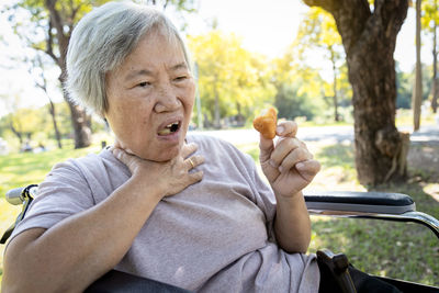 Portrait of man sitting with ice cream