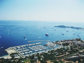 High angle view of city and harbor at waterfront