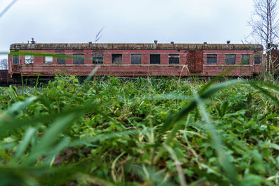 Built structure on field against sky