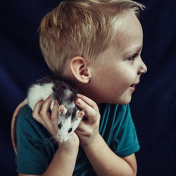 Close-up of boy and cat