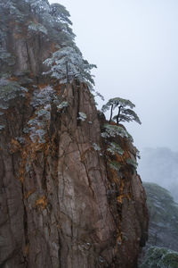 Rock formation on mountain against sky