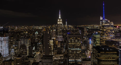 Illuminated buildings in city at night