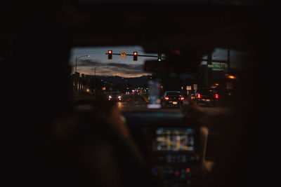 Cars on road in city at night