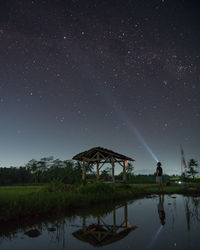 Scenic view of lake against star field at night