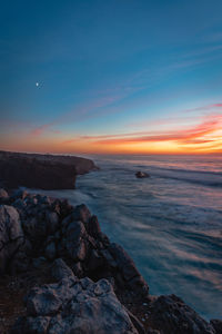 Scenic view of sea against sky during sunset